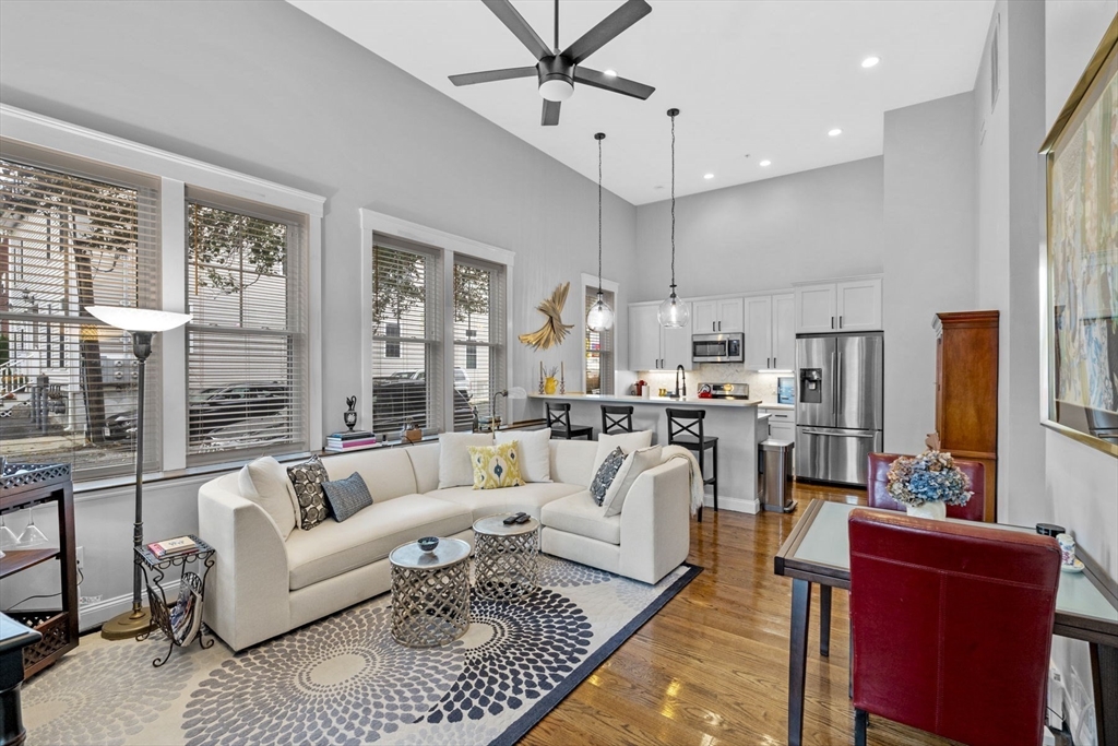 85 Bridge Street, Unit 3 Salem, MA 01970 - Photo 1 of 31 a living room with fireplace furniture and a large window