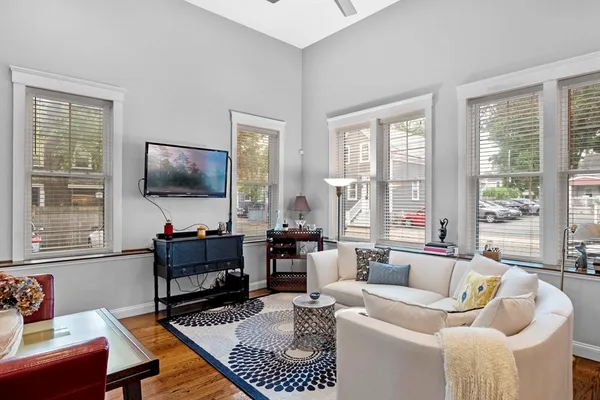 a living room with furniture and a flat screen tv