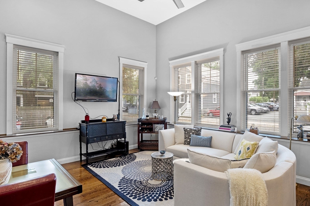 85 Bridge Street, Unit 3 Salem, MA 01970 - Photo 11 of 31 a living room with furniture and a flat screen tv