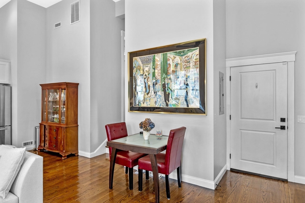 85 Bridge Street, Unit 3 Salem, MA 01970 - Photo 12 of 31 a dining room with furniture and wooden floor
