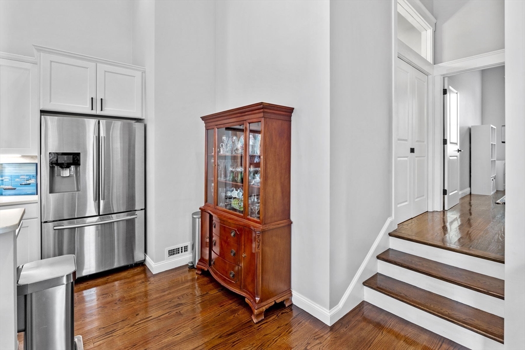 85 Bridge Street, Unit 3 Salem, MA 01970 - Photo 14 of 31 a kitchen with stainless steel appliances granite countertop a refrigerator and a stove top oven