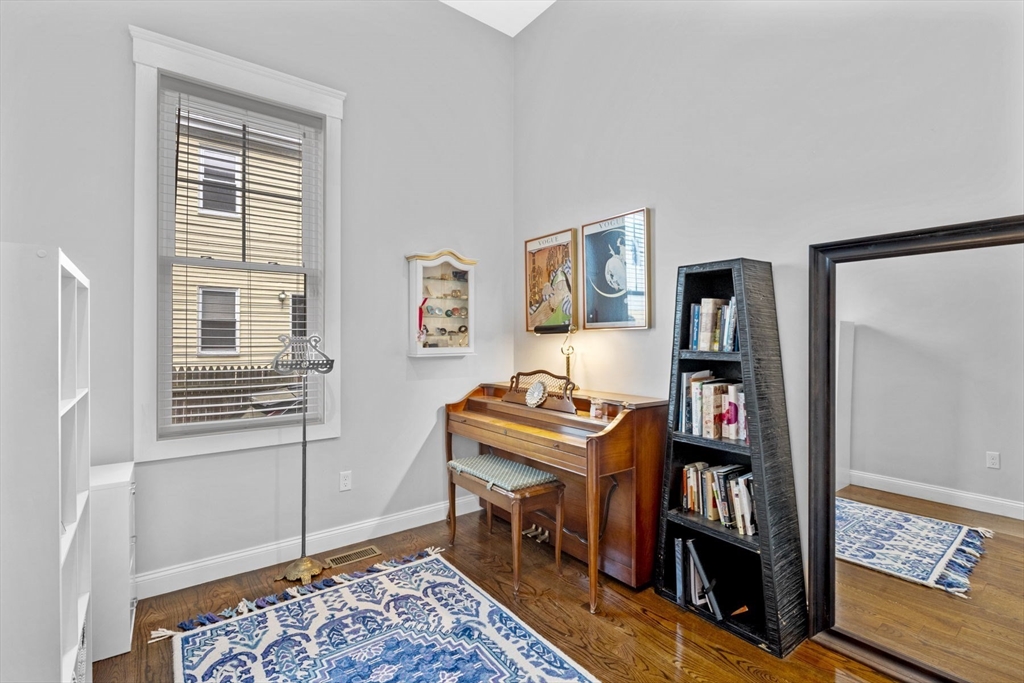 85 Bridge Street, Unit 3 Salem, MA 01970 - Photo 18 of 31 a room with a book shelf and a window