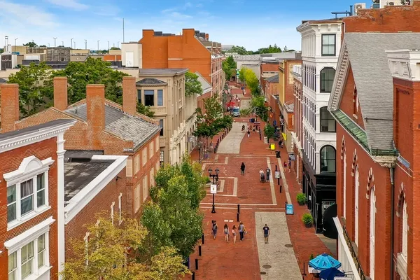 an aerial view of a residential apartment building with a yard
