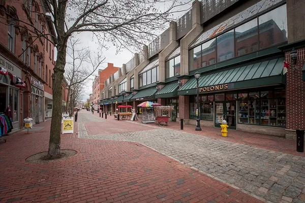 a view of street with shops on a patio