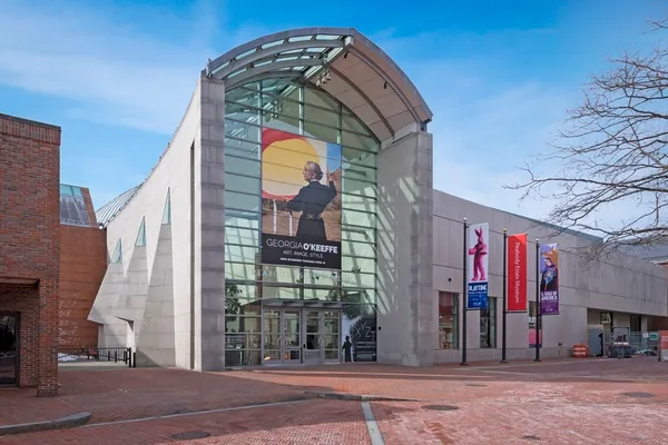 a view of a brick building with many windows