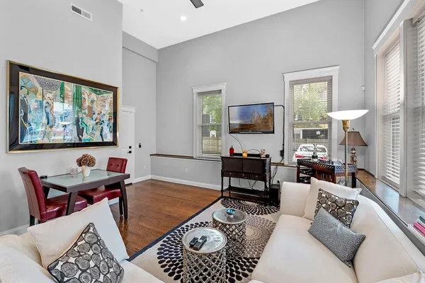 a living room with furniture or couch and a flat screen tv