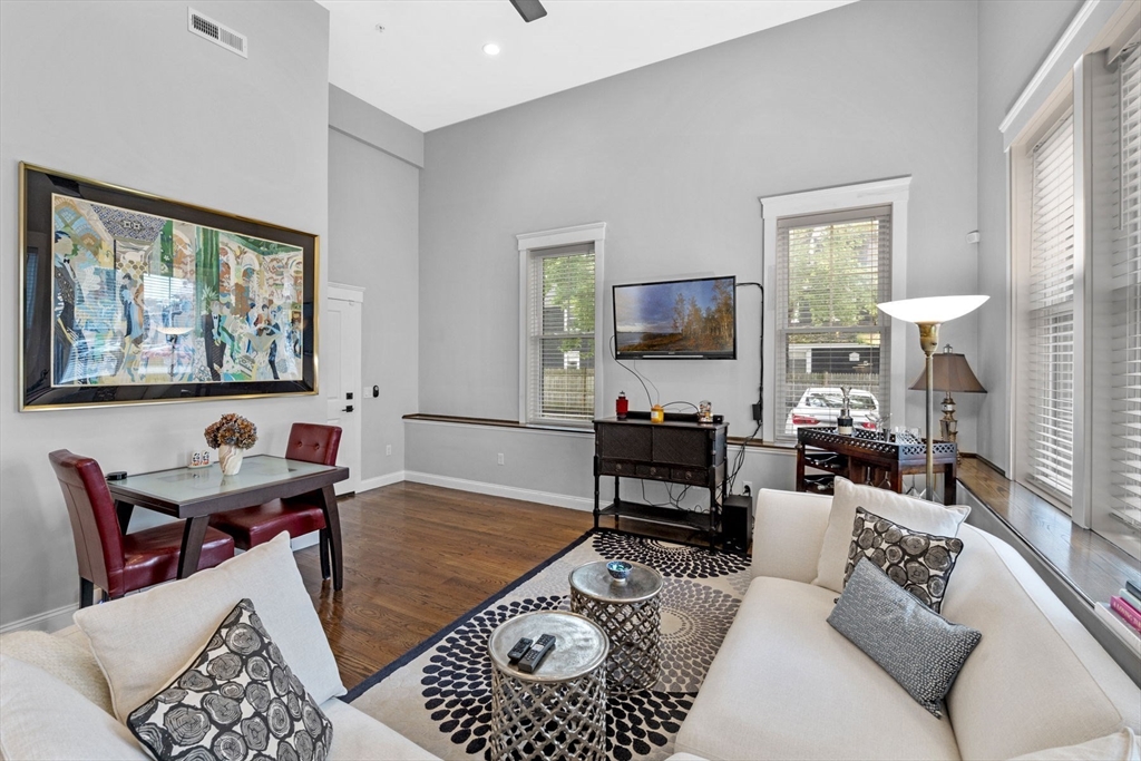 85 Bridge Street, Unit 3 Salem, MA 01970 - Photo 4 of 31 a living room with furniture or couch and a flat screen tv