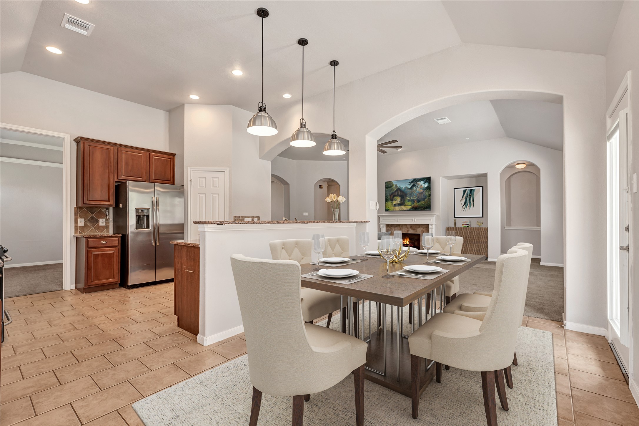 27 Planchard Court Spring, TX 77382 - Photo 5 of 16 a large kitchen with a table and chairs