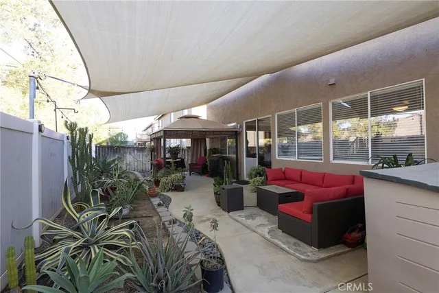 a view of a chairs and table in the balcony