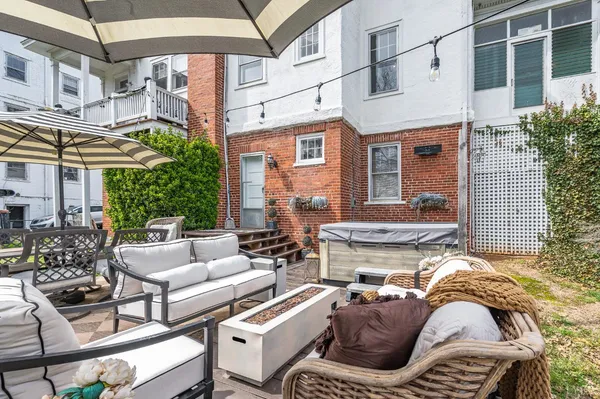 a backyard of a house with lots of green space and trampoline