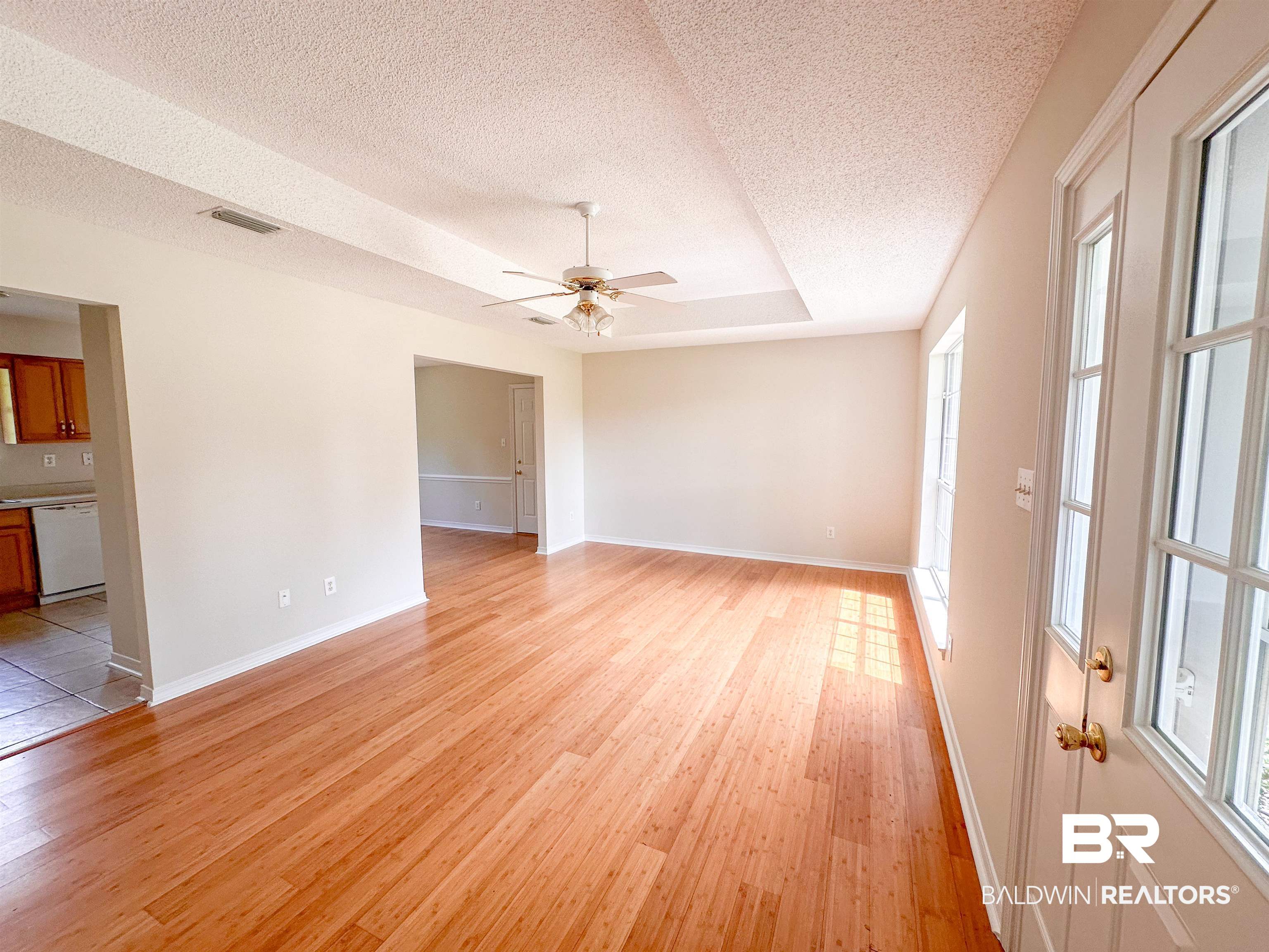 13255 Pointer Drive West Foley, AL 36535 - Photo 10 of 25 Interior space with a textured ceiling, light hardwood / wood-style flooring, a wealth of natural light, and ceiling fan