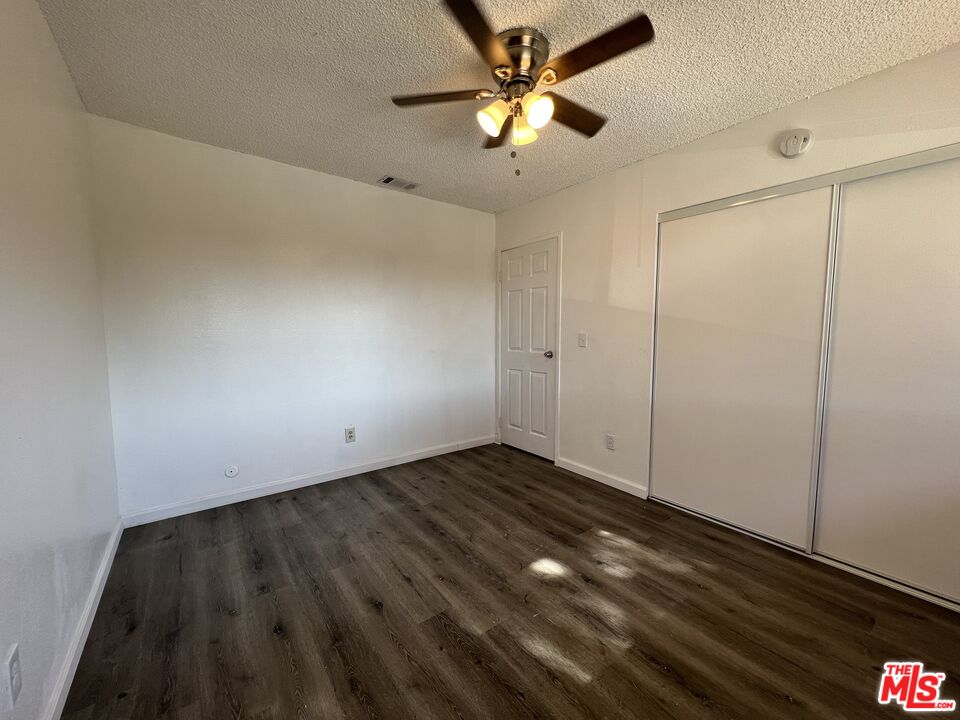 418 West Jackson Street Rialto, CA 92376 - Photo 19 of 24 wooden floor in an empty room