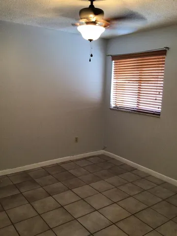 a bathroom with a shower and closet
