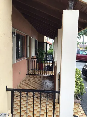 a kitchen with stainless steel appliances granite countertop a refrigerator and a stove