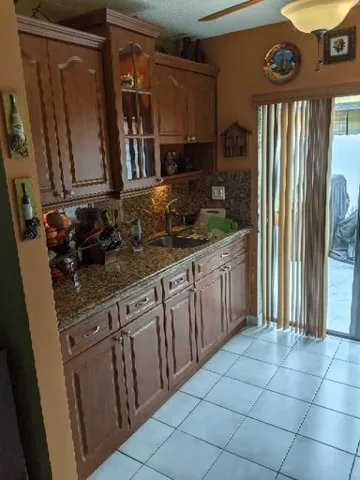 a kitchen with stainless steel appliances granite countertop a refrigerator and a stove