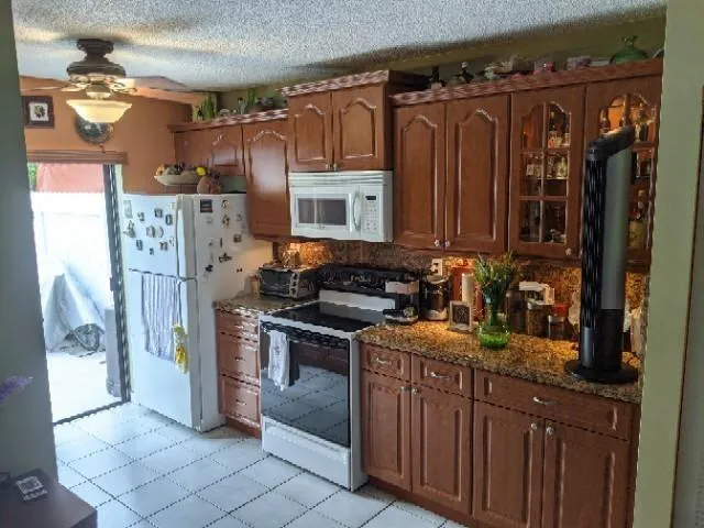 a view of a kitchen with a sink and cabinets