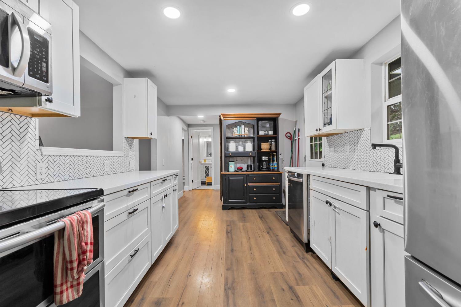 17721 Ridge Road Pine Grove, CA 95665 - Photo 4 of 21 a kitchen with stainless steel appliances a stove sink and cabinets