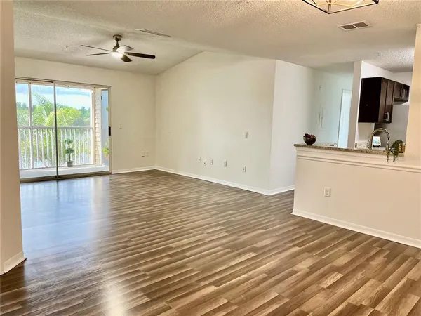 a view of a porch with a floor to ceiling window and stairs