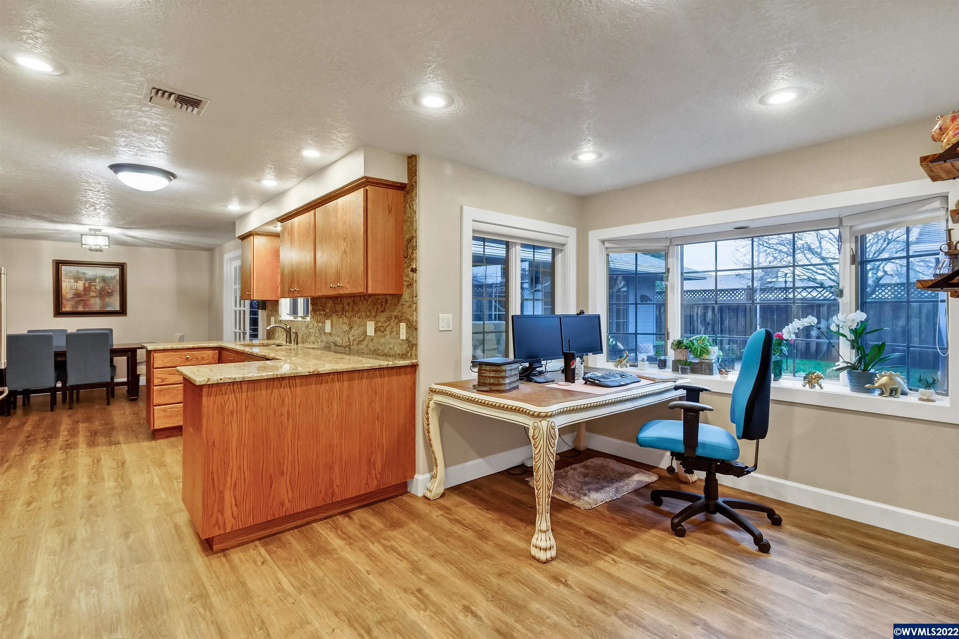 150 Edwards Road South Monmouth, OR 97361 - Photo 13 of 39 a view of a workspace with furniture and a wooden floor