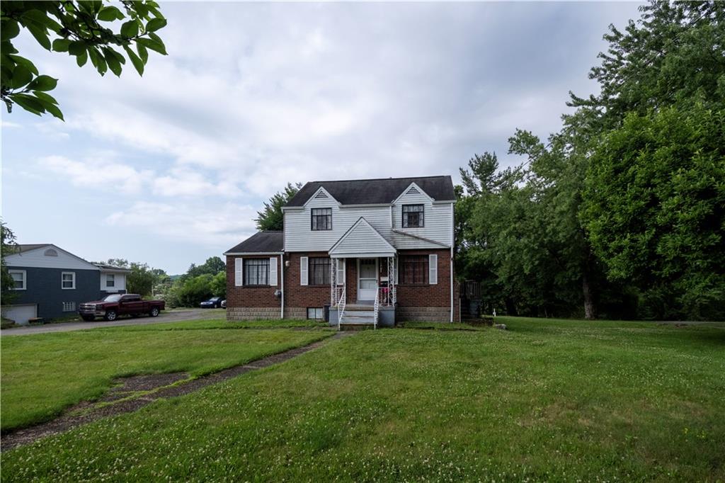 44 Forest Grove Road Coraopolis, PA 15108 - Photo 24 of 29 a front view of a house with a yard
