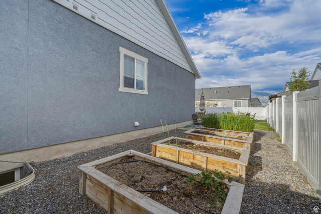 870 North Ada Loop Lehi, UT 84048 - Photo 49 of 51 Side yard with three raised garden beds