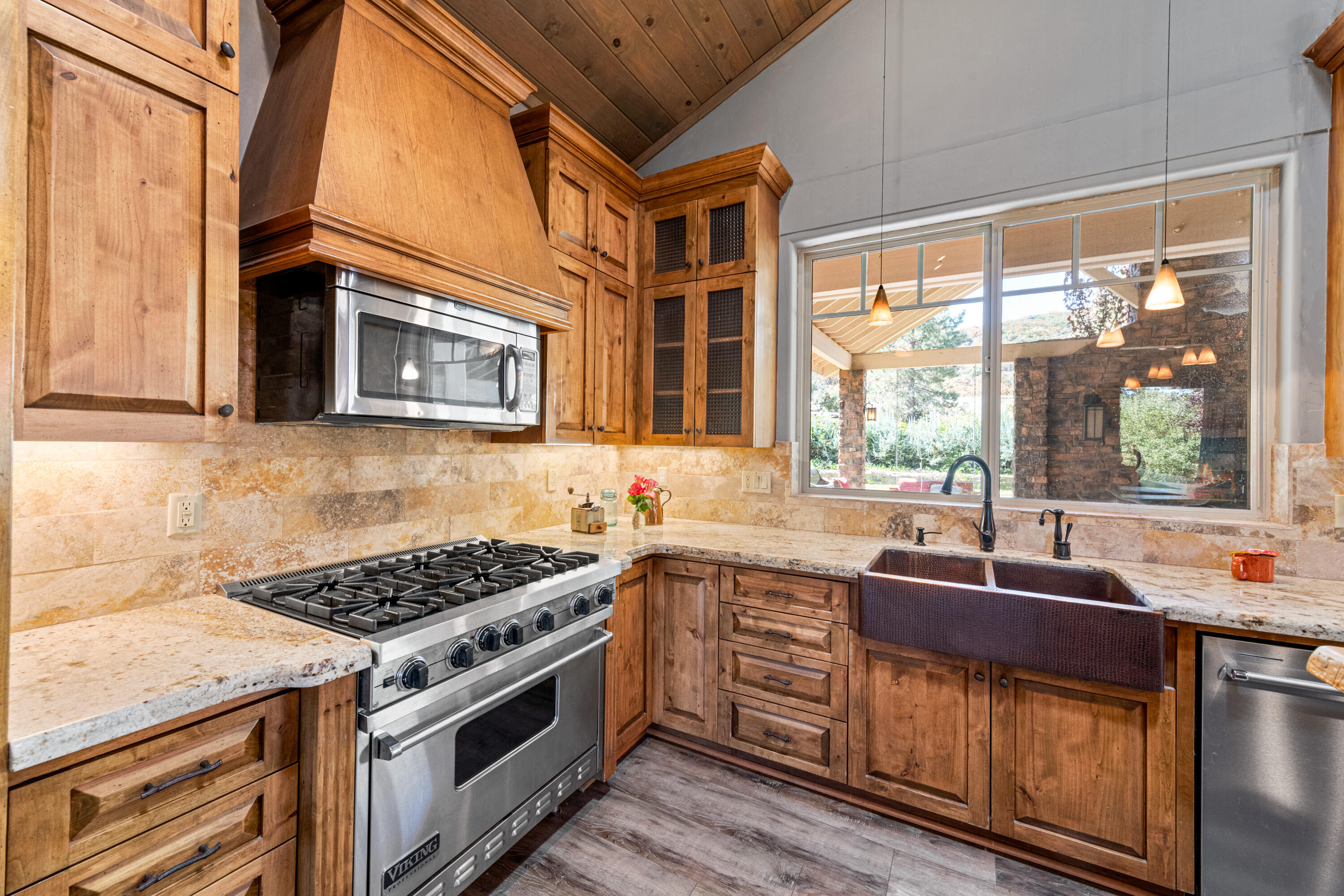 59985 Hop Patch Spring Road Mountain Center, CA 92561 - Photo 11 of 63 a kitchen with stainless steel appliances a stove sink and microwave