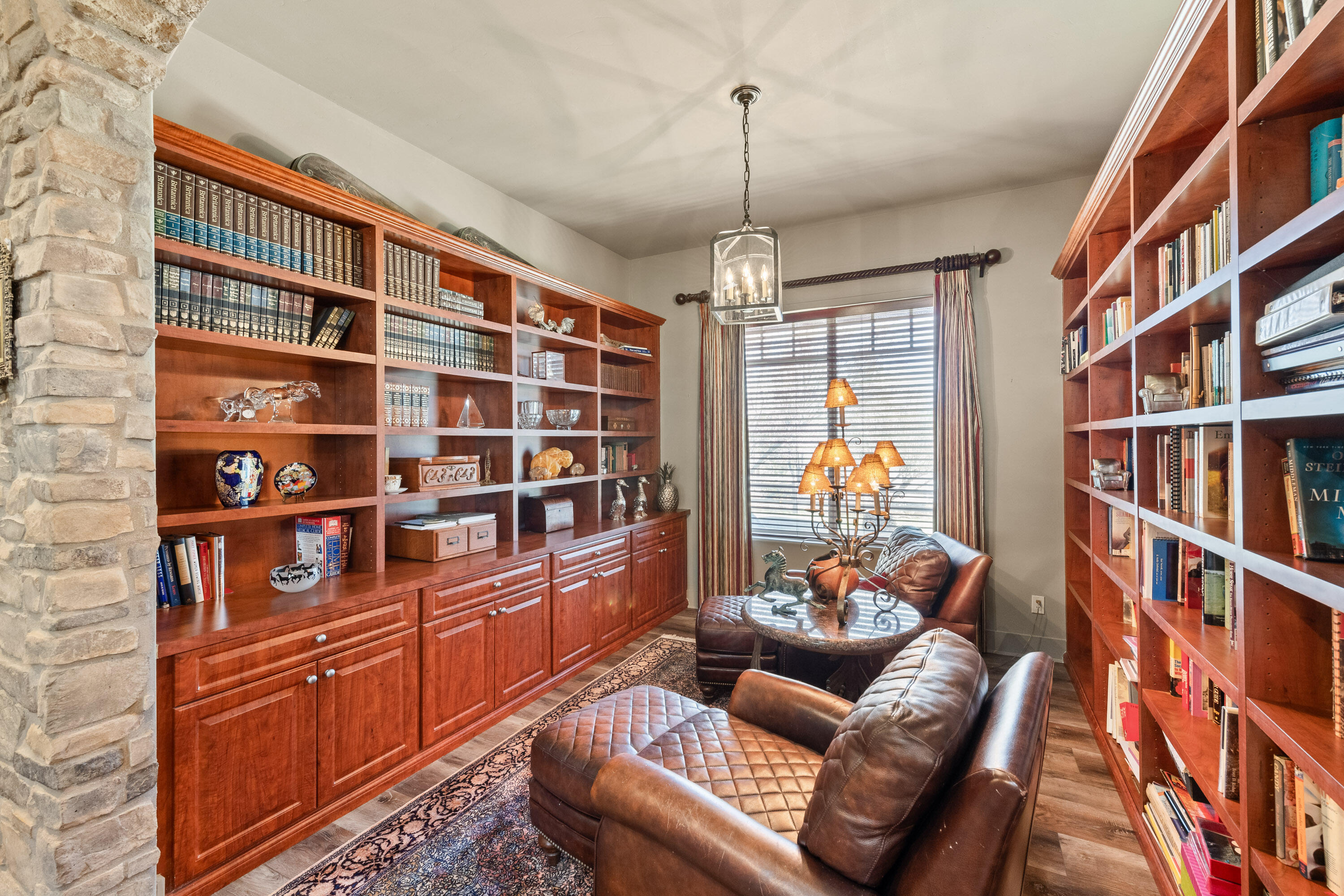 59985 Hop Patch Spring Road Mountain Center, CA 92561 - Photo 15 of 63 a living room with furniture and a book shelf