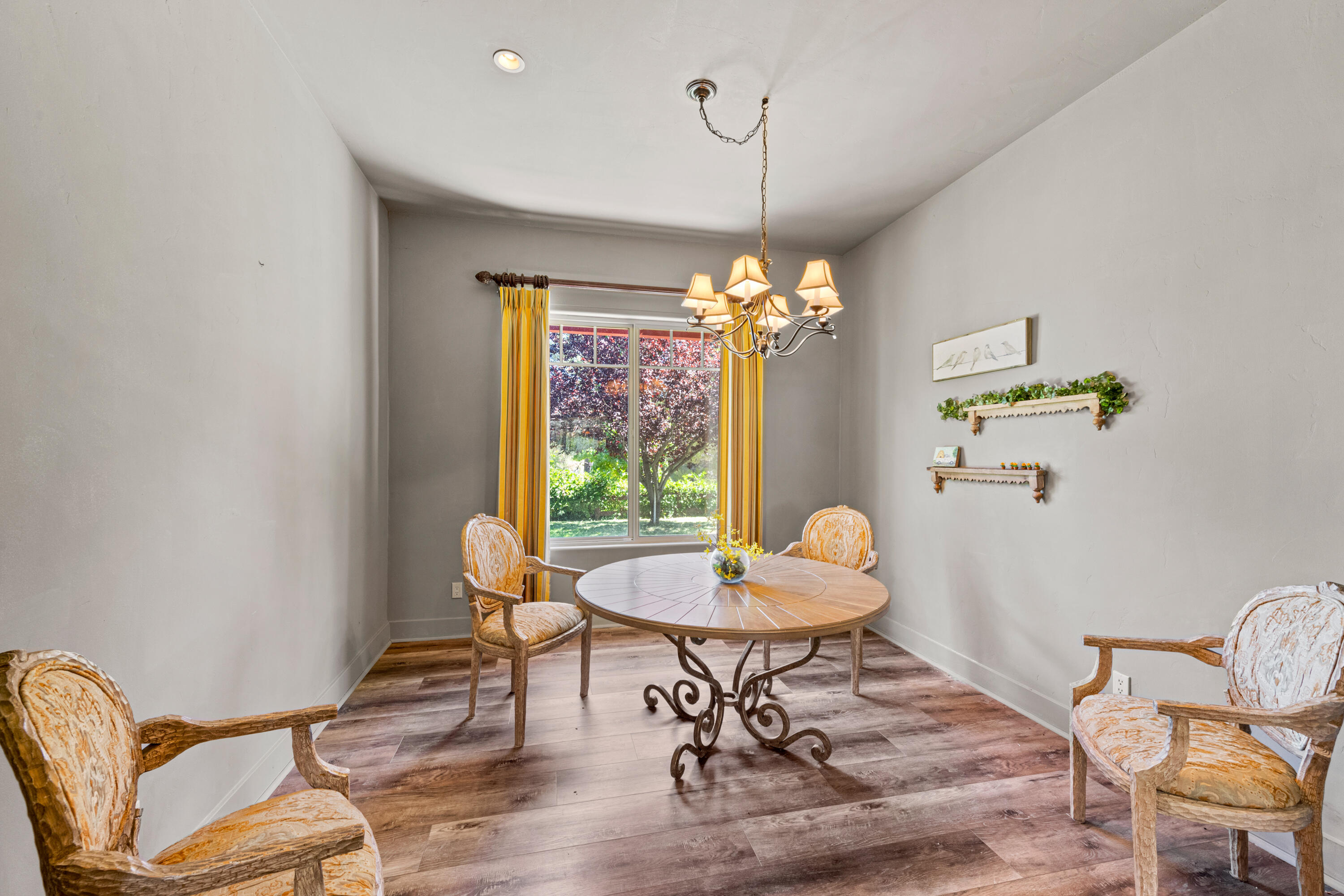 59985 Hop Patch Spring Road Mountain Center, CA 92561 - Photo 16 of 63 a view of a dining room with furniture a chandelier and wooden floor
