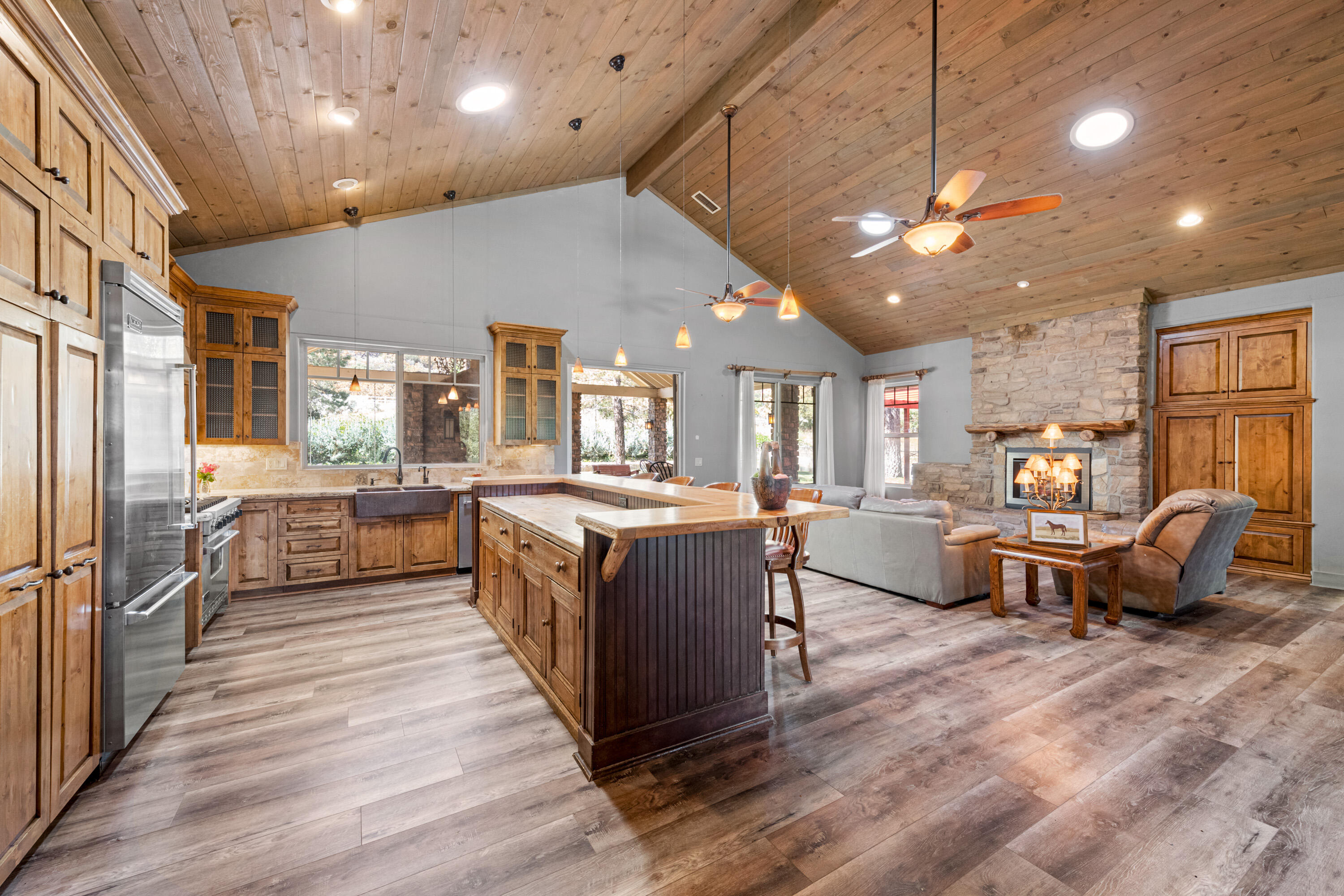 59985 Hop Patch Spring Road Mountain Center, CA 92561 - Photo 17 of 63 a large open kitchen with stainless steel appliances kitchen island granite countertop a large counter top and stainless steel appliances