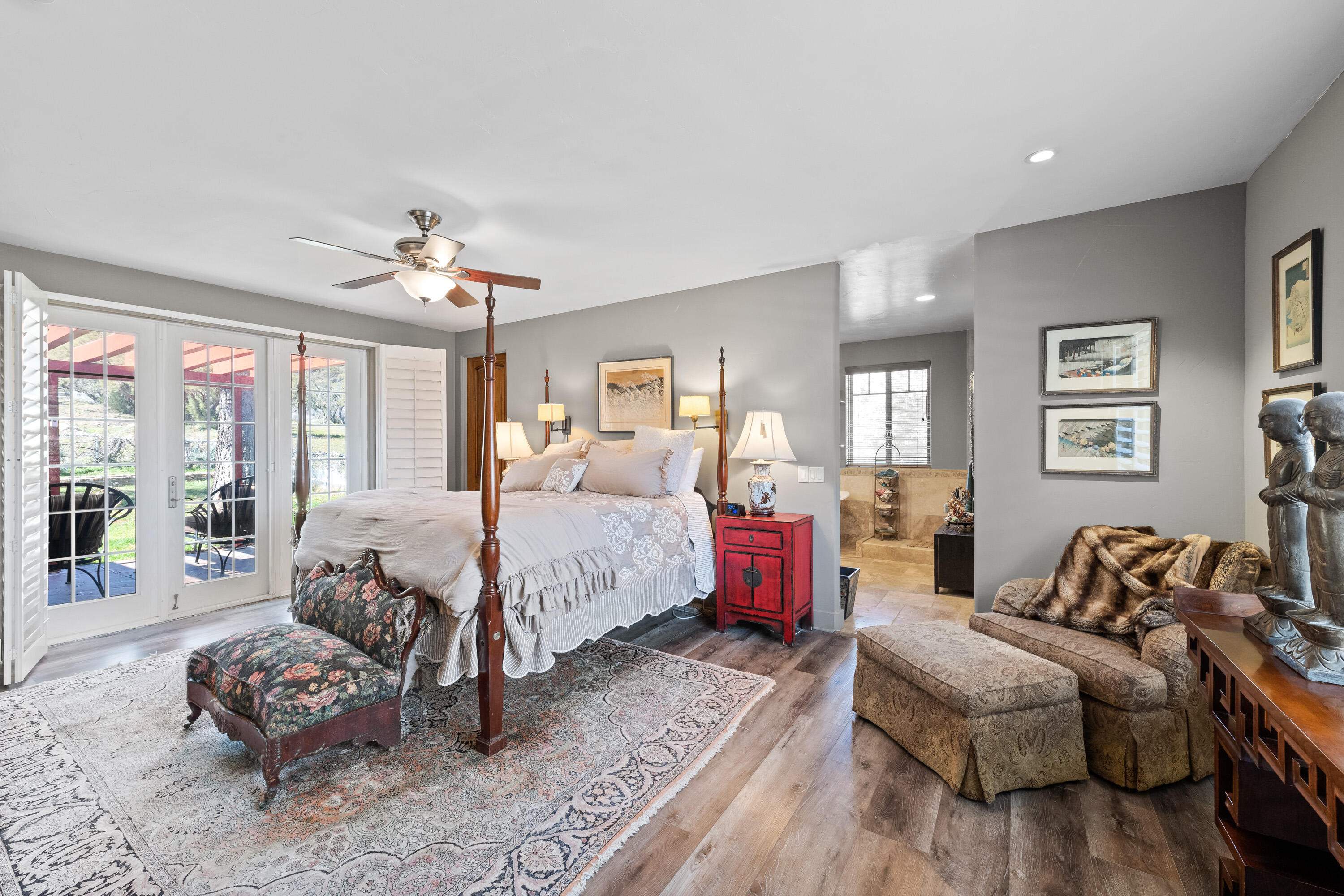 59985 Hop Patch Spring Road Mountain Center, CA 92561 - Photo 18 of 63 a spacious bedroom with a bed and wooden floor