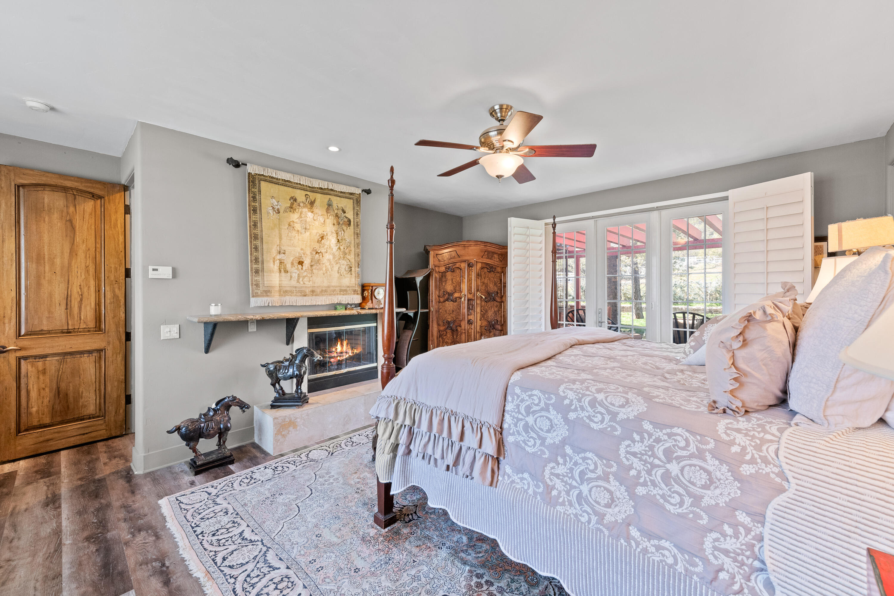 59985 Hop Patch Spring Road Mountain Center, CA 92561 - Photo 19 of 63 a bedroom with a bed and a chandelier