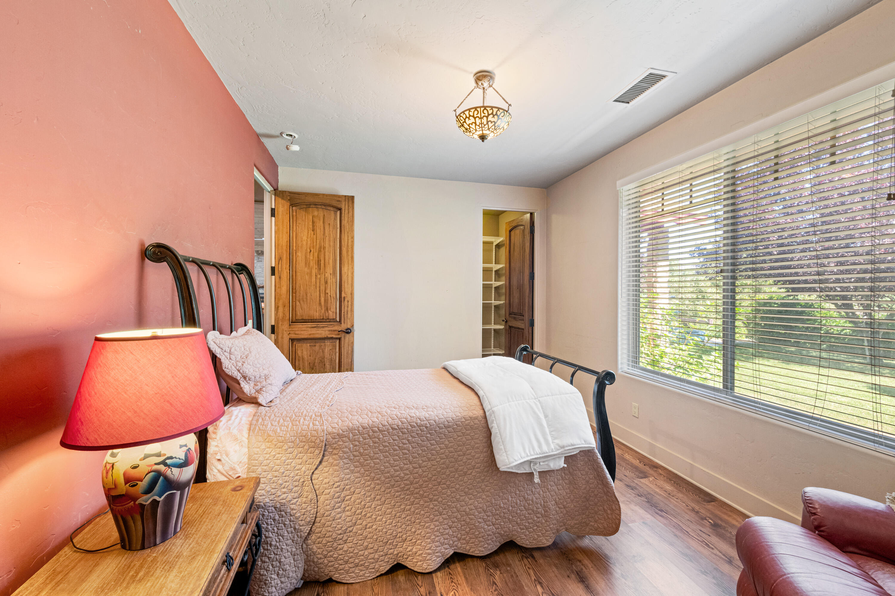 59985 Hop Patch Spring Road Mountain Center, CA 92561 - Photo 23 of 63 a bed sitting in a bedroom next to a window