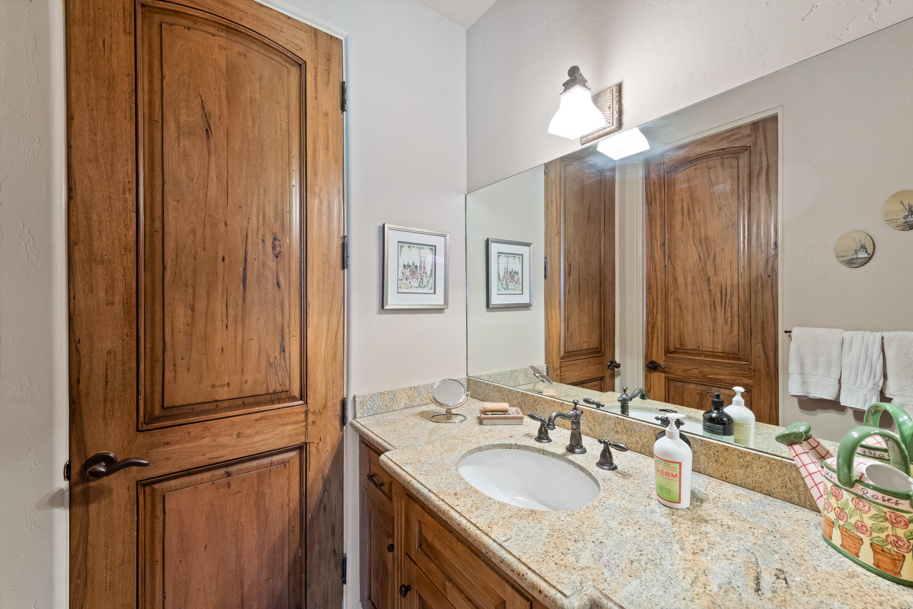 59985 Hop Patch Spring Road Mountain Center, CA 92561 - Photo 25 of 63 a bathroom with a granite countertop sink and a mirror