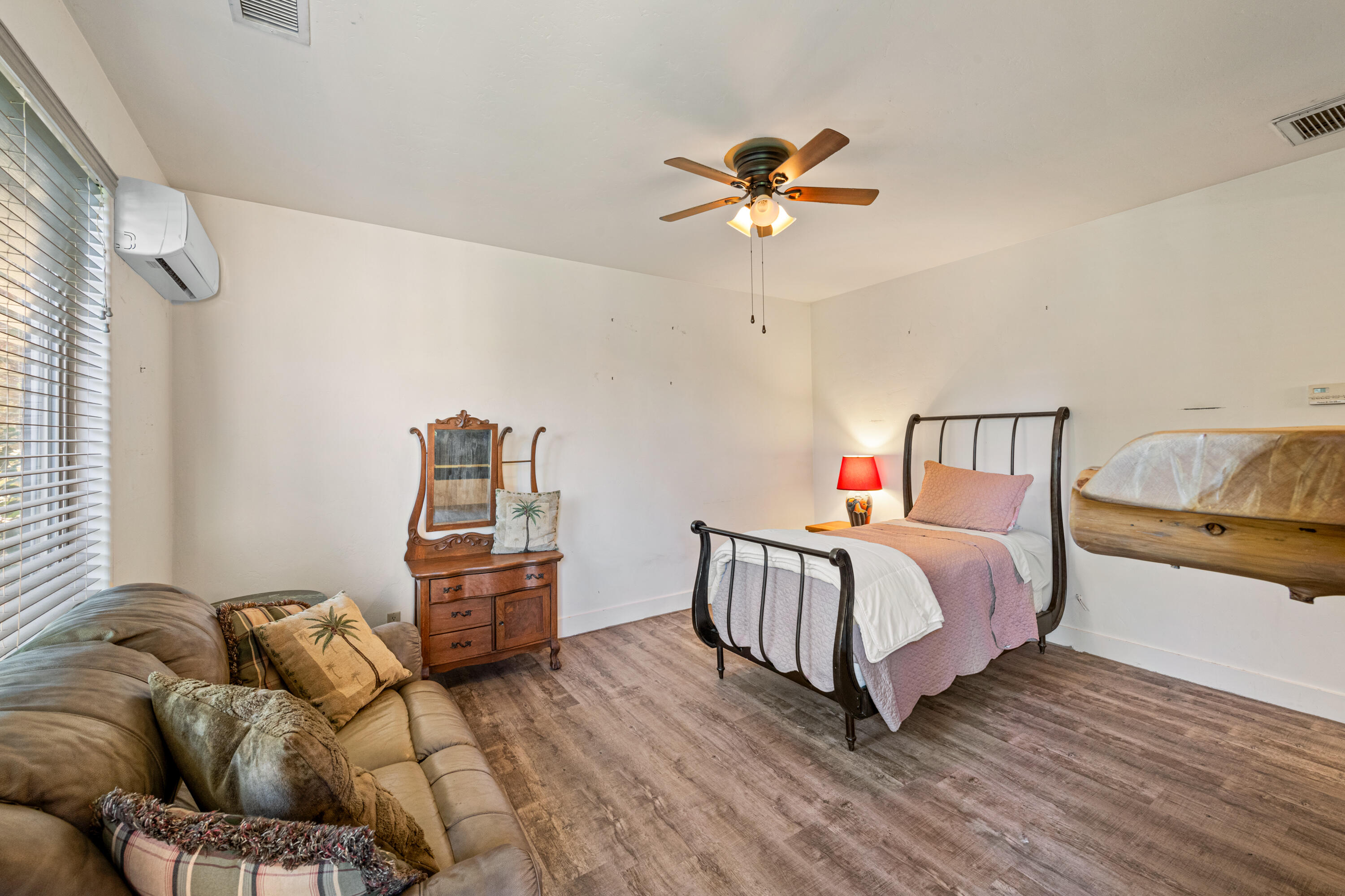 59985 Hop Patch Spring Road Mountain Center, CA 92561 - Photo 31 of 63 a bedroom with a bed and wooden floor