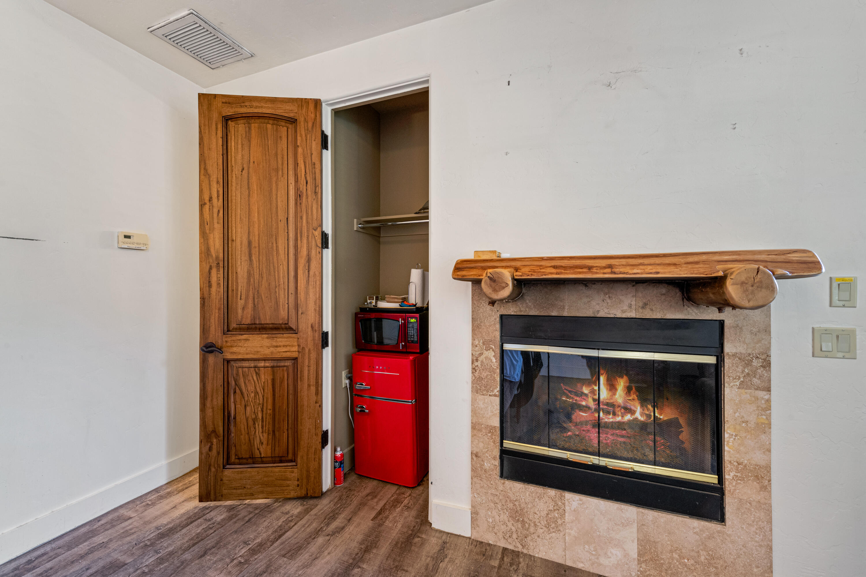 59985 Hop Patch Spring Road Mountain Center, CA 92561 - Photo 34 of 63 a room with fireplace and wooden floor