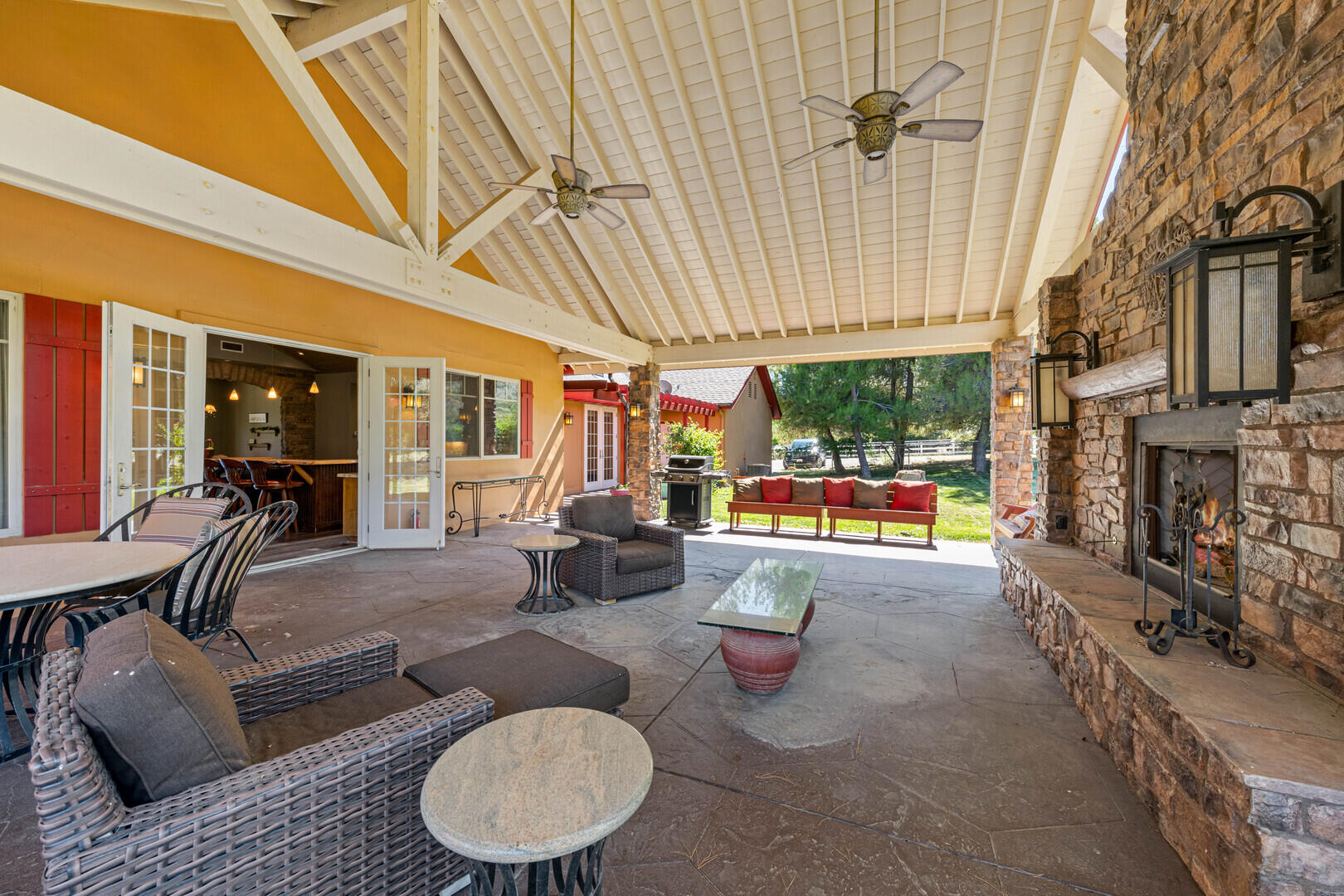 59985 Hop Patch Spring Road Mountain Center, CA 92561 - Photo 40 of 63 a living room with patio furniture and a fireplace