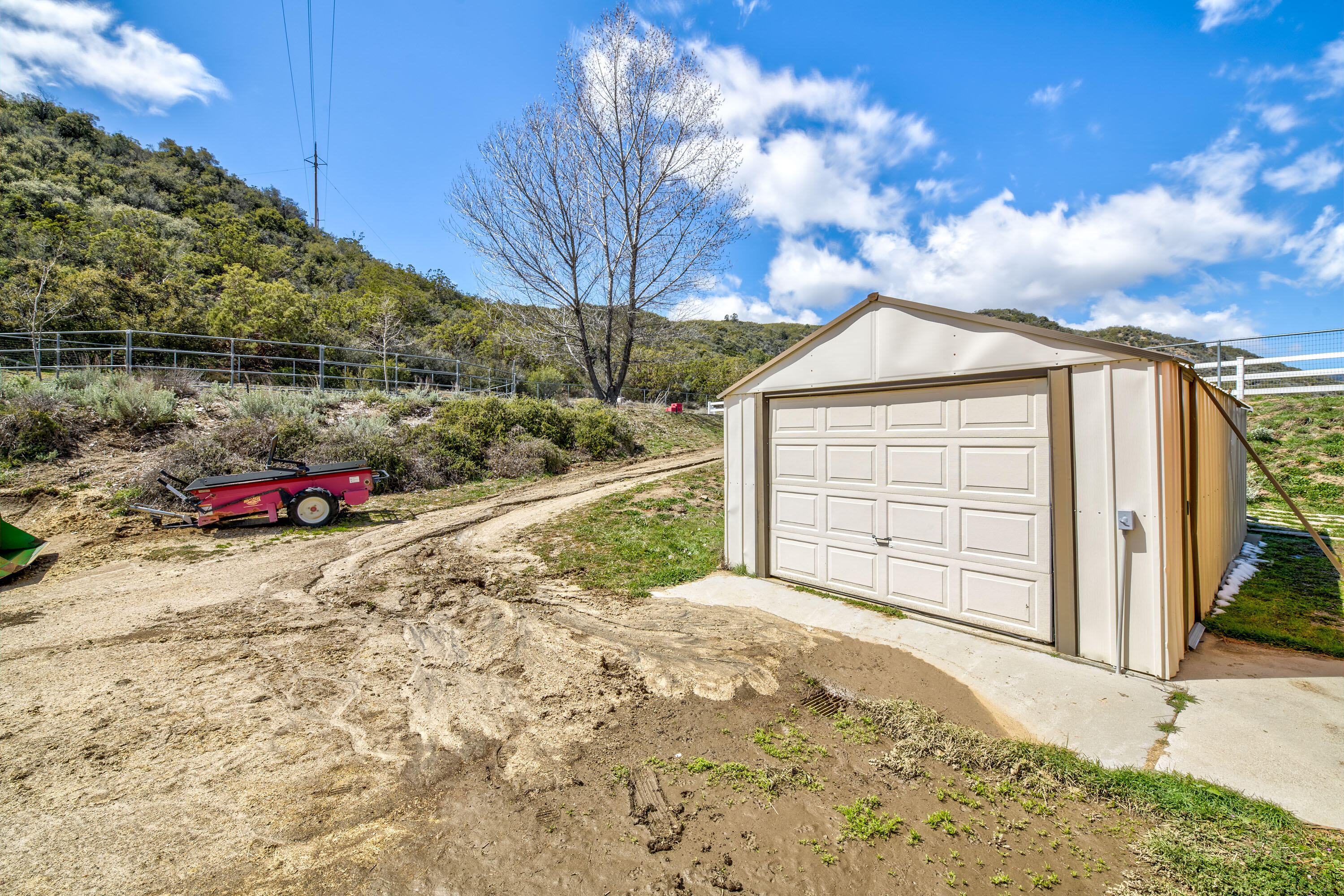 59985 Hop Patch Spring Road Mountain Center, CA 92561 - Photo 49 of 63 a view of a house with a garage