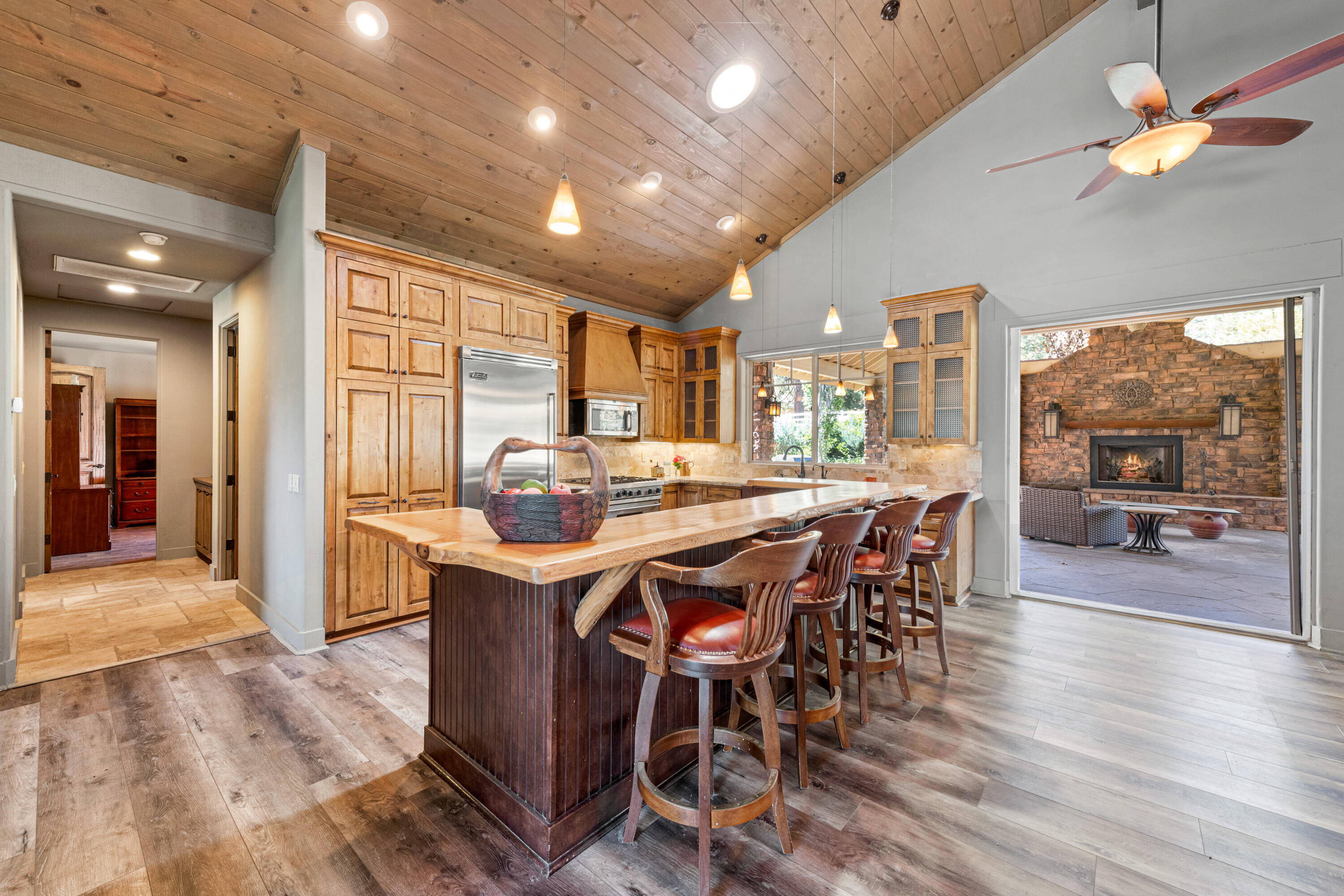 59985 Hop Patch Spring Road Mountain Center, CA 92561 - Photo 10 of 63 a kitchen with stainless steel appliances a dining table chairs and wooden floor