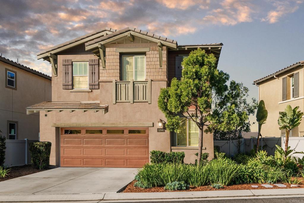 1244 Via Candelas Oceanside, CA 92056 - Photo 1 of 60 a front view of a house with a yard