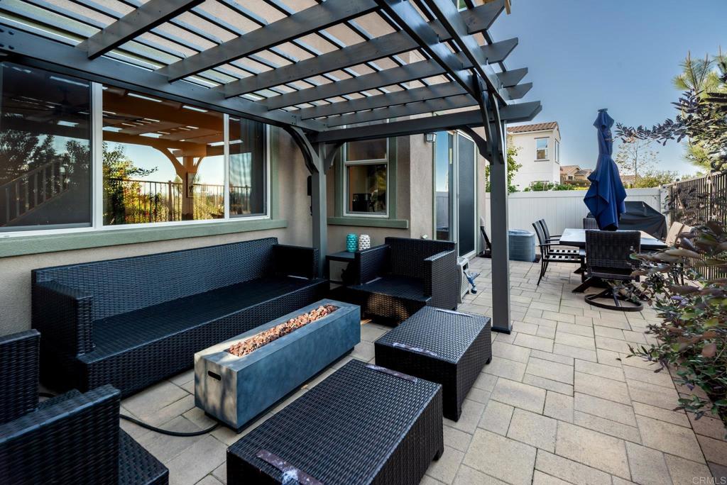 1244 Via Candelas Oceanside, CA 92056 - Photo 17 of 60 a building outdoor space with patio furniture and potted plants