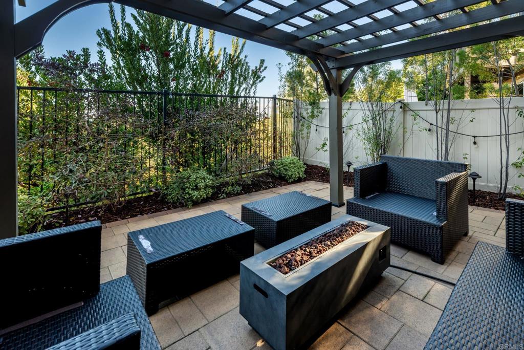 1244 Via Candelas Oceanside, CA 92056 - Photo 19 of 60 a outdoor living space with furniture and a potted plant