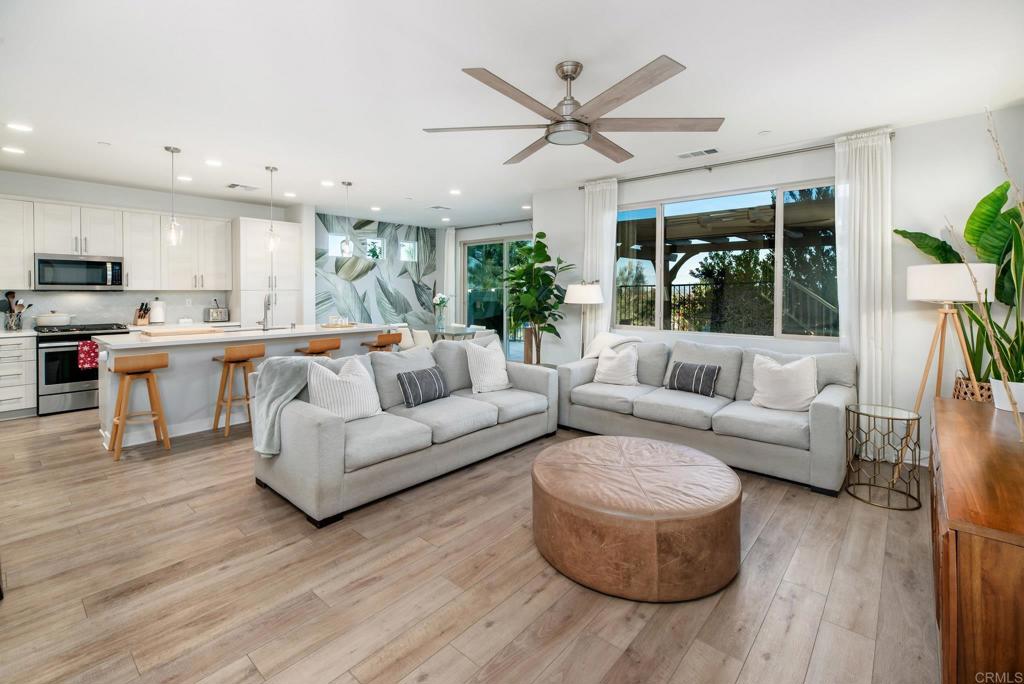 1244 Via Candelas Oceanside, CA 92056 - Photo 21 of 60 a living room with furniture and a large window