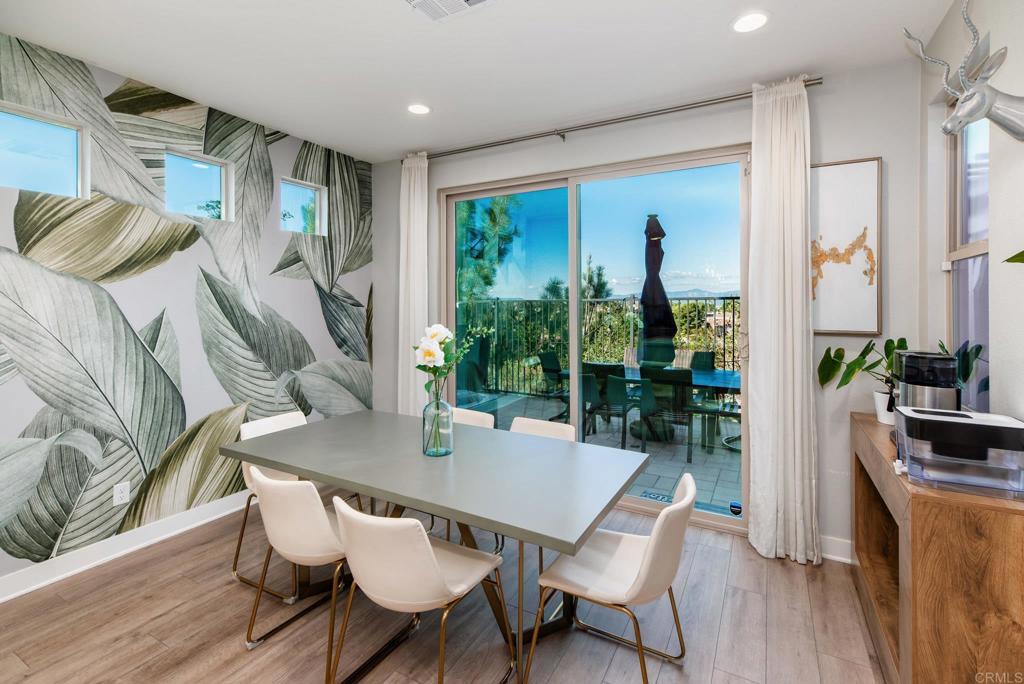 1244 Via Candelas Oceanside, CA 92056 - Photo 25 of 60 a view of a dining room with furniture window and wooden floor