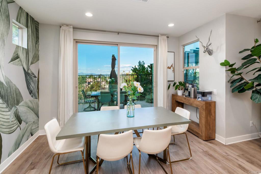 1244 Via Candelas Oceanside, CA 92056 - Photo 26 of 60 a view of a dining room with furniture window and wooden floor