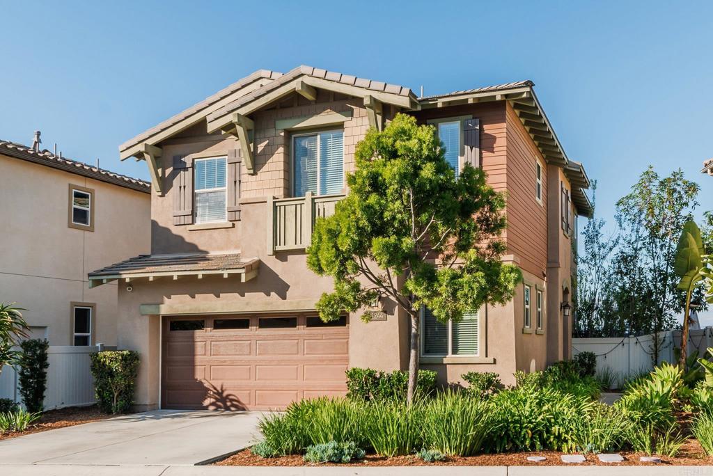 1244 Via Candelas Oceanside, CA 92056 - Photo 3 of 60 a front view of a house with plants and entryway