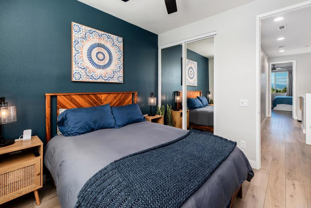 1244 Via Candelas Oceanside, CA 92056 - Photo 38 of 60 a bedroom with a bed and a couch