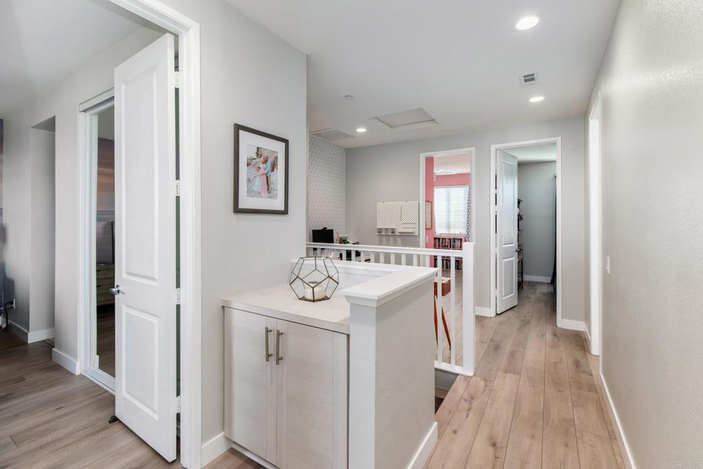 1244 Via Candelas Oceanside, CA 92056 - Photo 40 of 60 a view of a hallway with washer and dryer