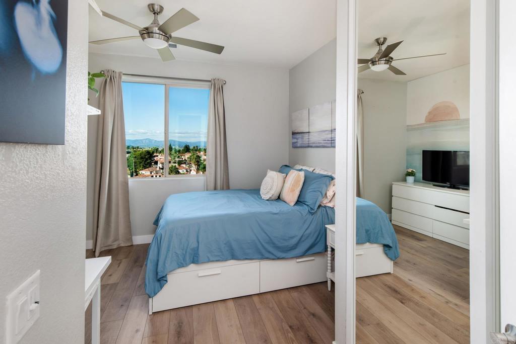 1244 Via Candelas Oceanside, CA 92056 - Photo 43 of 60 a bedroom with a bed and a view of bathroom