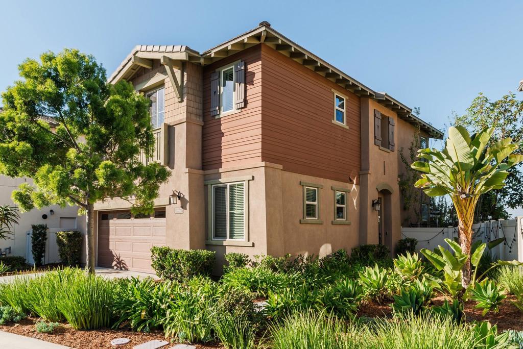 1244 Via Candelas Oceanside, CA 92056 - Photo 5 of 60 a front view of a house with a garden