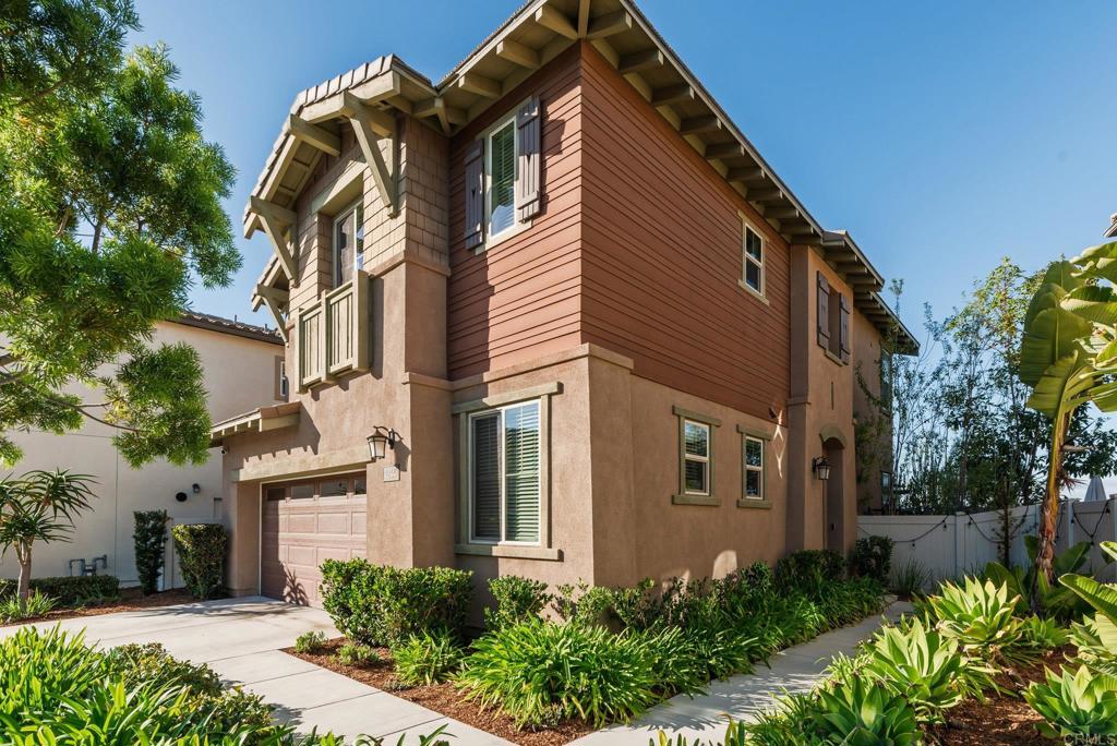 1244 Via Candelas Oceanside, CA 92056 - Photo 6 of 60 a front view of a house with a garden
